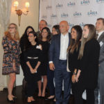 business professionals pose for a picture during the Long Island Hospitality Association 2018 kick off meeting